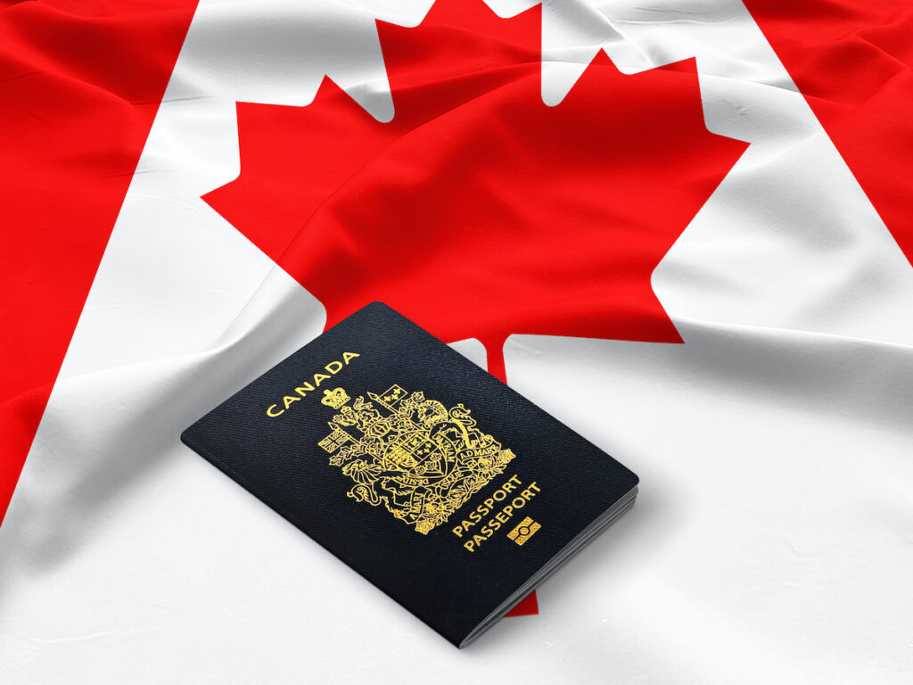 passport on canadian flag