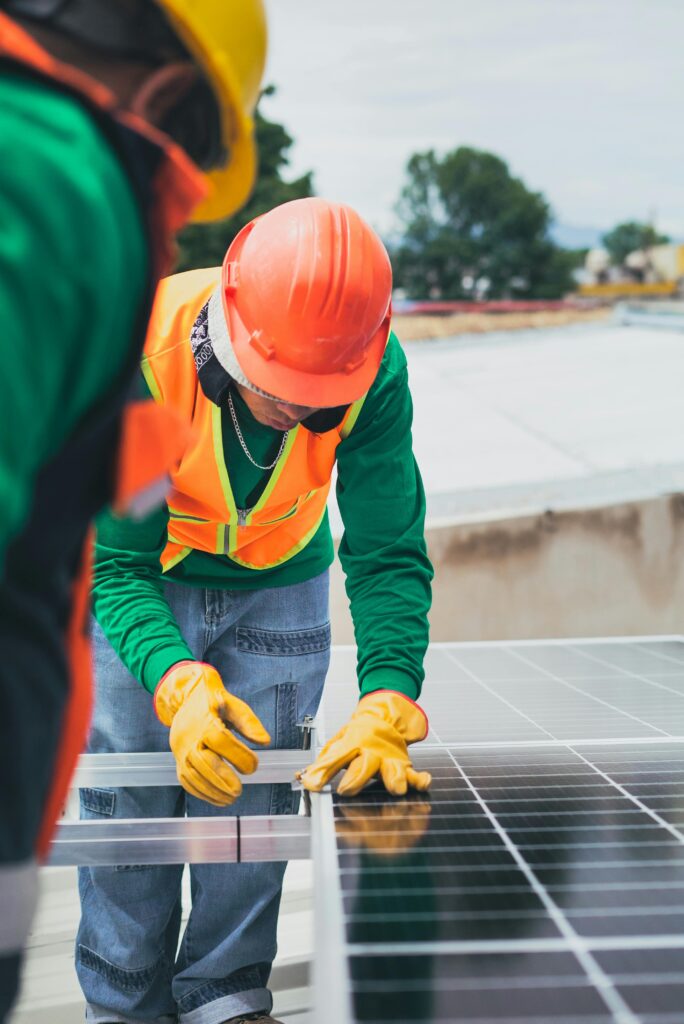 man fixing a solar panel