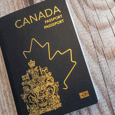 canadian passport on wooden background