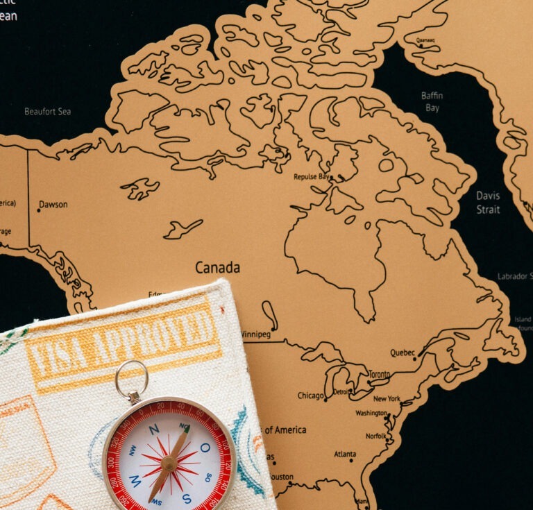 map of americas and a compass